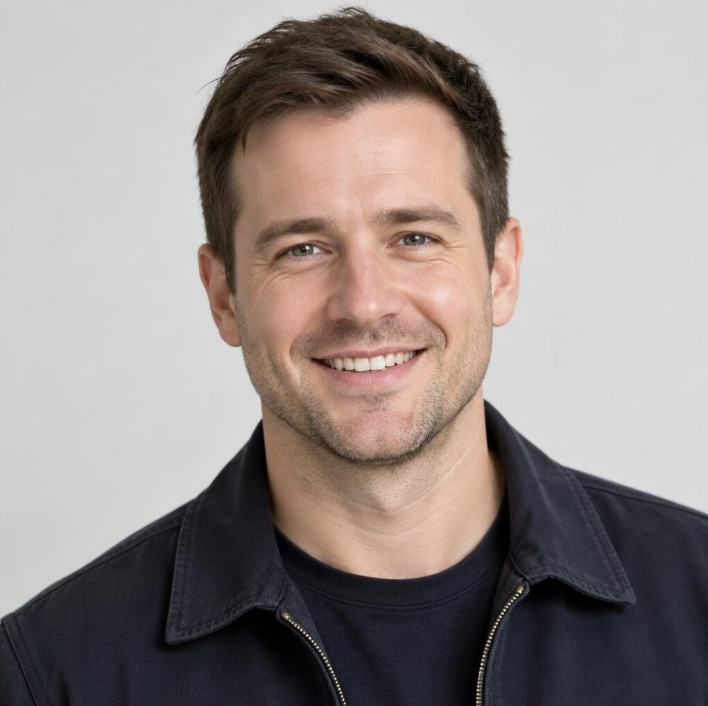 Portrait of a smiling British man in his thirties with short brown hair