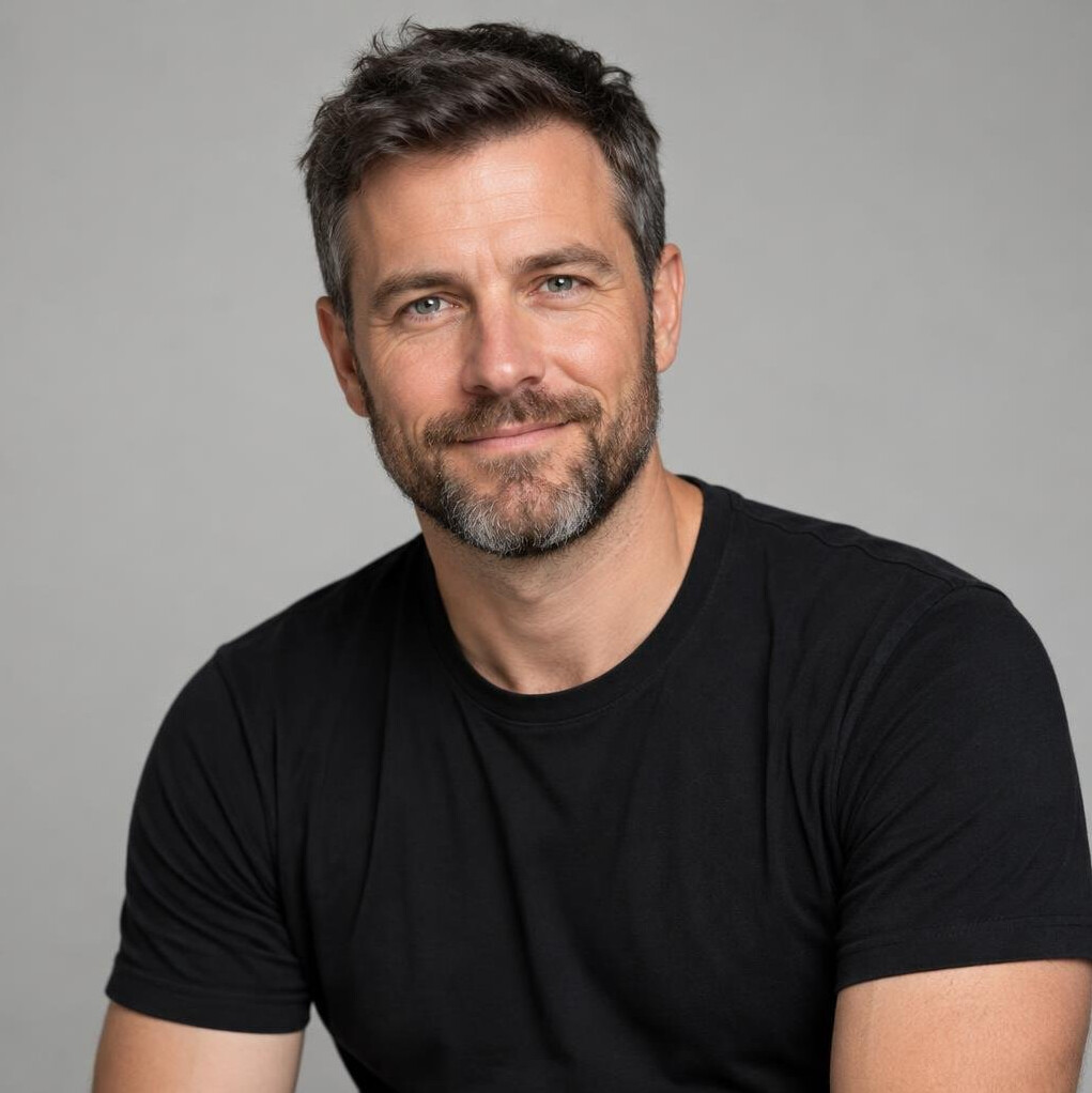 Portrait of a bearded man in his forties wearing a black t-shirt