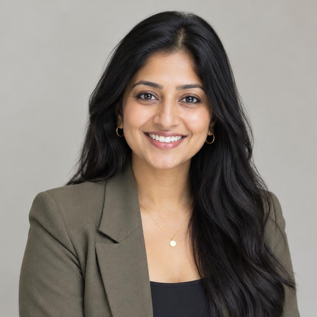 Portrait of a smiling British Indian woman with long dark hair