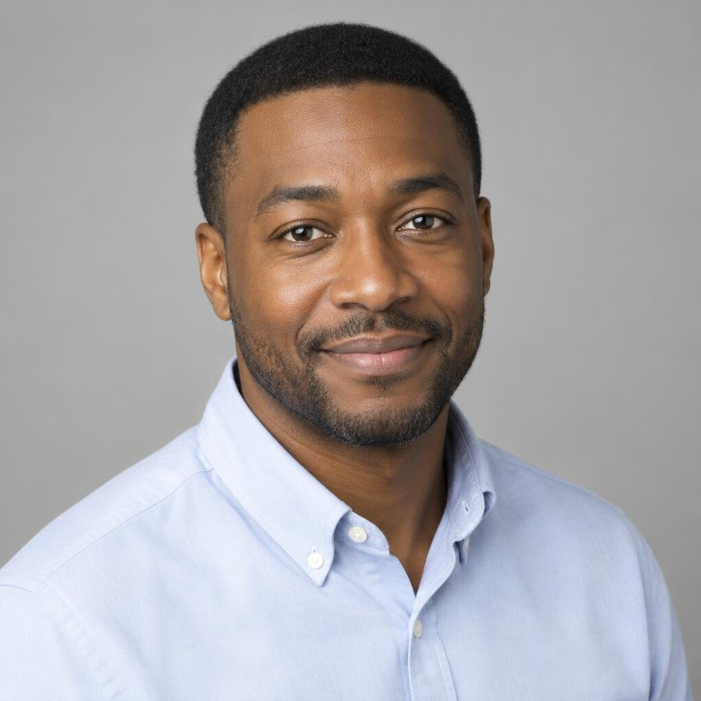 Portrait of a man in a collared shirt with short dark hair